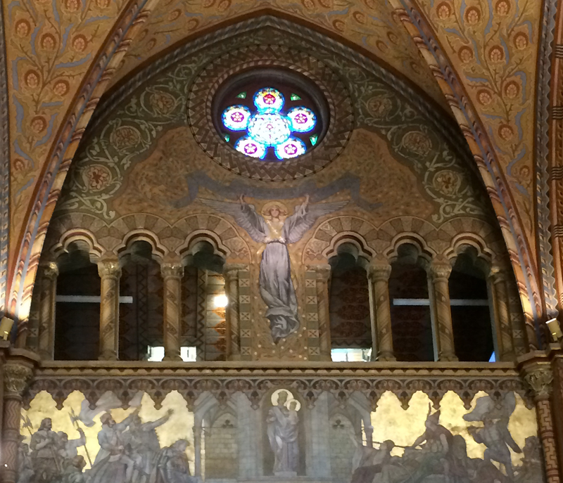 Image of a chapel with a mosaic of a triumphant  angel.  Image link to Evaluation and Assessment samples. 